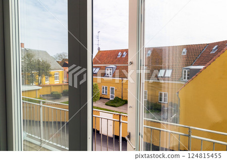 Open window overlooking the street on a summer day 124815455