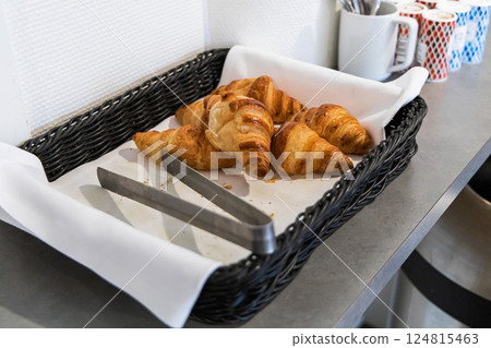 Fresh croissants in a bastet in a hotel kitchen. 124815463