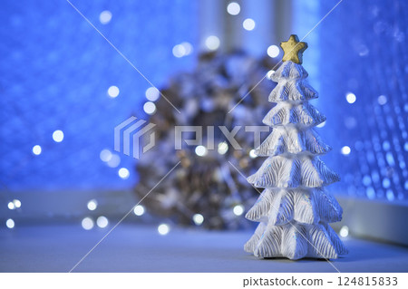 Christmas tree and wreath decorated by the window - Christmas image 124815833