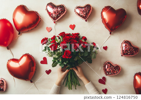 Florist preparing red roses bouquet for valentine's day with heart balloons 124816750