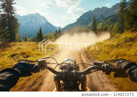 A rider navigates a winding dirt path on a motorcycle, surrounded by tall trees and majestic mountains. Dust rises behind the bike as it speeds through the vibrant natural landscape. A rider navigates a winding dirt path on a motorcycle, surrounded by tall trees and majestic mountains. Dust rises behind the bike as it speeds through the vibrant natural landscape. 124817273