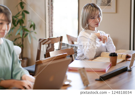 A young woman thinking in a cafe A young woman thinking in a cafe 124818034