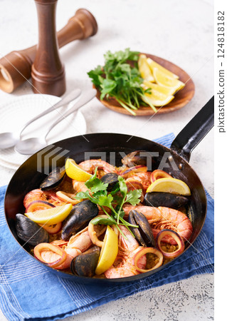 Paella made in a frying pan 124818182