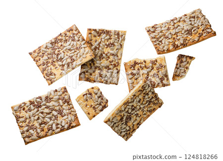 Crackers and pieces flying close-up on a white. Isolated 124818266