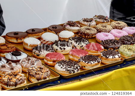 Assorted Colorful Donuts on Golden Tray 124819364