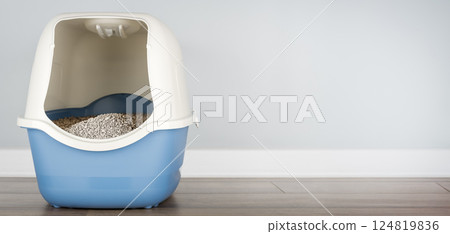 Hooded cat litter box in the room. Hooded cat litter box in the room. 124819836
