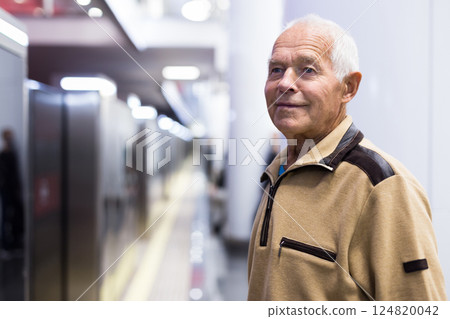 Old man in subway station Old man in subway station 124820042