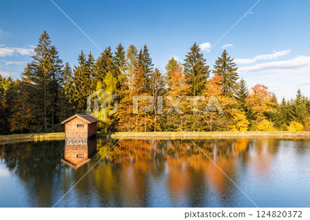 Autumn landscape with beautiful colorful trees reflected in the lake. Beskydy Mountains in Czech Republic, Europe. Autumn landscape with beautiful colorful trees reflected in the lake. Beskydy Mountains in Czech Republic, Europe. 124820372