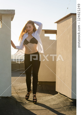 Young sexy woman posing in the roof, Lifestyle portrait 124821249