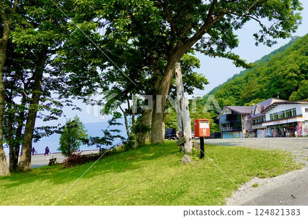 Lake Towada, a view of the red postbox in front of the Nenokuchi General Information Center, Okuze, Towada City, Aomori Prefecture 124821383