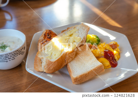 Western-style breakfast plate with bread, pizza and soup 124821628
