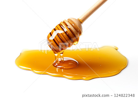 Honey dripping from dipper isolated on white background 124822348