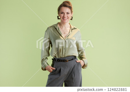 Confident woman in green blouse 124822881