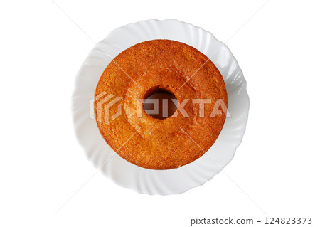 corn cake on white plate isolated on white background. Typical Brazilian party food. corn cake on white plate isolated on white background. Typical Brazilian party food. 124823373
