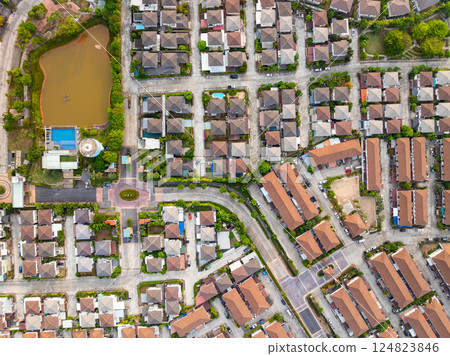 New development real estate. Aerial view of residential houses and driveways neighborhood during a fall sunset or sunrise time. Tightly packed homes. Top view over private houses in phuket thailand New development real estate. Aerial view of residential houses and driveways neighborhood during a fall sunset or sunrise time. Tightly packed homes. Top view over private houses in phuket thailand 124823846