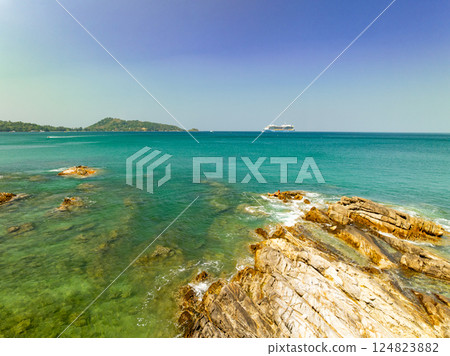 Beautiful seashore nature landscape in phuket Thailand,Amazing landscape waves crashing on rock in summer season background,Wide angle view drone shot Beautiful seashore nature landscape in phuket Thailand,Amazing landscape waves crashing on rock in summer season background,Wide angle view drone shot 124823882
