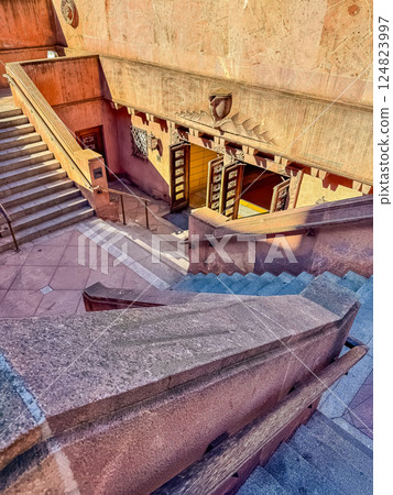 Historic Stone Staircase Entrance with Warm Sunlight and Geometric Architecture. High quality photo 124823997