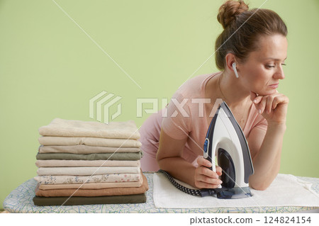 Pensive ironing: Calm thoughts at home Pensive ironing: Calm thoughts at home 124824154