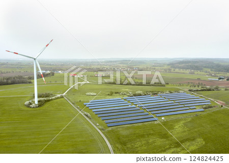 Drone view with solar panels farm and wind turbine Drone view with solar panels farm and wind turbine 124824425