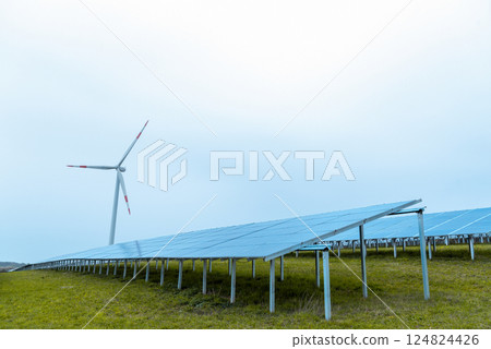 Solar panels and one wind turbine in nature in Germany Solar panels and one wind turbine in nature in Germany 124824426