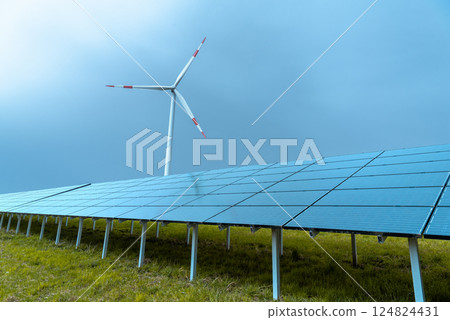 Solar panels farm and a wind turbine in Germany Solar panels farm and a wind turbine in Germany 124824431