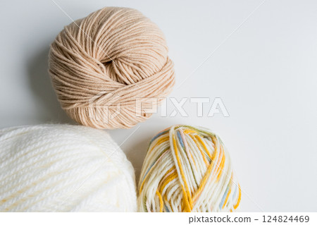 Assorted yarn balls in neutral and multicolor tones for knitting and crochet Assorted yarn balls in neutral and multicolor tones for knitting and crochet 124824469