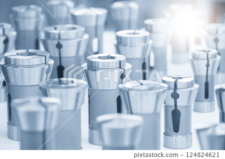 Close up scene the various type of CNC collets in the light blue scene. 124824621