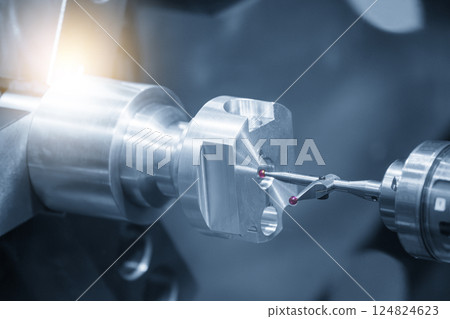 The modular touch probe checking the aluminum shaft parts on CNC lathe machine in the light blue scene. The modular touch probe checking the aluminum shaft parts on CNC lathe machine in the light blue scene. 124824623