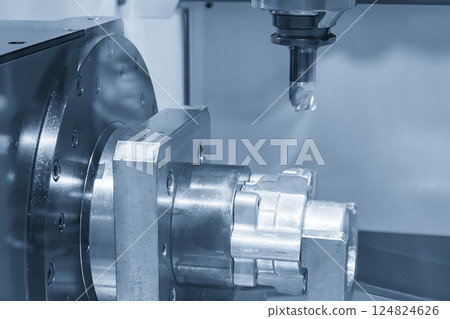 The 4-axis CNC milling machine cutting the automotive parts in the light blue scene. The 4-axis CNC milling machine cutting the automotive parts in the light blue scene. 124824626