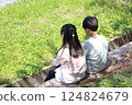 Elementary school boys and girls sitting side by side 124824679