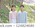 Elementary school boys and girls standing in a spring park 124824680