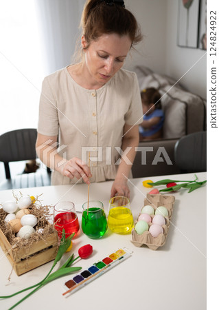 Engaging in Creative Easter Egg Decorating with a Variety of Vibrant Colors and Themes Engaging in Creative Easter Egg Decorating with a Variety of Vibrant Colors and Themes 124824922