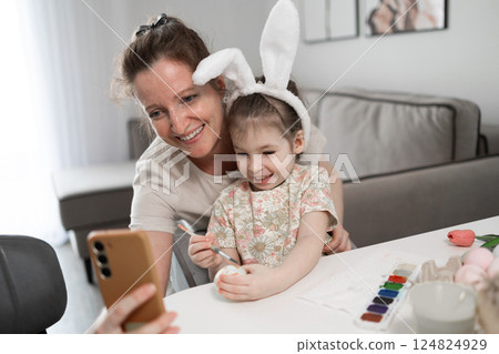 Enjoying Joyful Easter Crafting Moments with Mother and Daughter, Creating Lasting Memories Enjoying Joyful Easter Crafting Moments with Mother and Daughter, Creating Lasting Memories 124824929