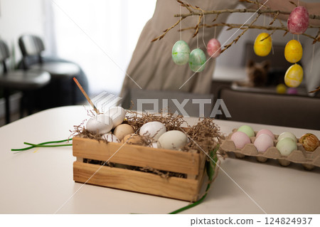 Beautiful and Colorful Easter Decorations Featuring Festive Eggs and Twigs for a Joyful Atmosphere 124824937