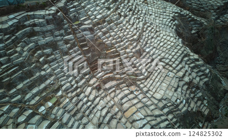 Aerial view of the salt fields of Maras | A spectacular geometric view across the Andes 124825302