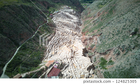 Aerial view of the salt fields of Maras | A spectacular geometric view across the Andes Aerial view of the salt fields of Maras | A spectacular geometric view across the Andes 124825305