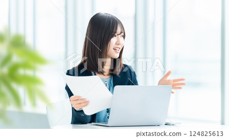 Smiling woman/businesswoman having a conversation Smiling woman/businesswoman having a conversation 124825613