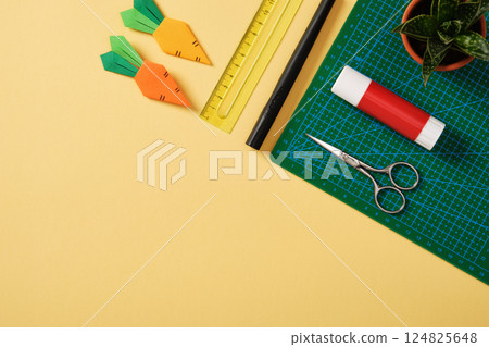 Paper art supplies: scissors, glue, ruler, felt-tip pen, cutting mat. A place for your text. A desk for paper crafts. 124825648