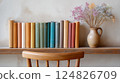 Cozy Shelf with Vintage Books and Dried Flowers in a Minimalist Interior Setting 124826709