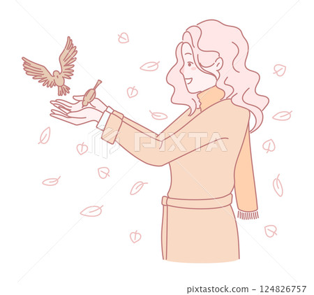 A woman with a bird among vibrant leaves symbolizes freedom and natures beauty A woman with a bird among vibrant leaves symbolizes freedom and natures beauty 124826757