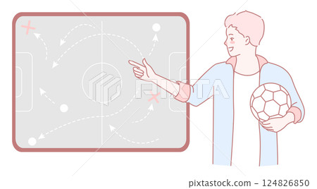 A Soccer Coach is skillfully illustrating tactics on a board while holding a ball in hand A Soccer Coach is skillfully illustrating tactics on a board while holding a ball in hand 124826850