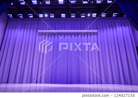 A stage with a platform in the form of a podium with a trendy purple color on the background. Fabric wavy background with space for copying. An element for your design. High quality photo 124827158