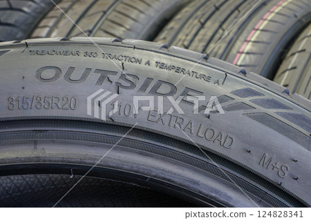 Side view of a tire with an indication of tire outside, width, height, diameter, load, speed index Side view of a tire with an indication of tire outside, width, height, diameter, load, speed index 124828341