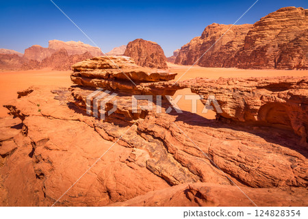 Wadi Rum, Jordan. Little Bridge arch and Khor Al Ajram featuring towering cliffs and stunning desert scenery. 124828354