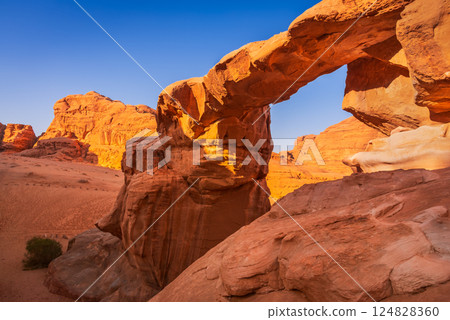 Wadi Rum, Jordan. Um Fruth in Wadi Rum is a famous natural rock arch, Arabia Desert. 124828360