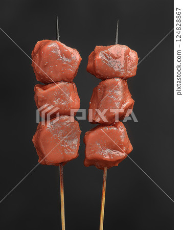 Delicious food featuring grilled meat kebab skewers perfect for barbecue cuisine. 124828867