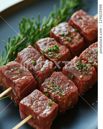 Delicious beef kebab skewers with rosemary and spices on grill for gourmet barbecue cooking 124828996