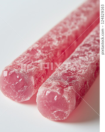 Bright pink candy with sweet sugar texture and frosted crystal ice, a refreshing treat. 124829163