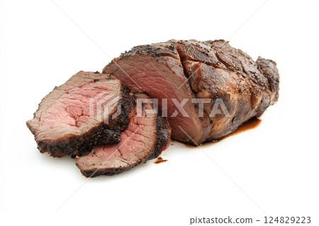 Juicy cooked beef roast with sliced meat for a delicious dinner meal. Juicy cooked beef roast with sliced meat for a delicious dinner meal. 124829223