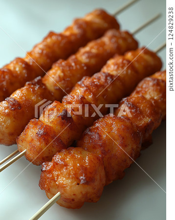 Delicious grilled kebab skewers of roasted chicken, a tasty and savory barbecue dish 124829238